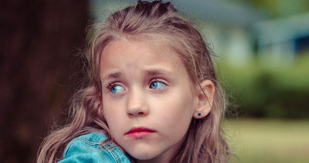 Young girl looks sad