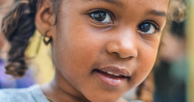 Close up of young black girl, slight smile