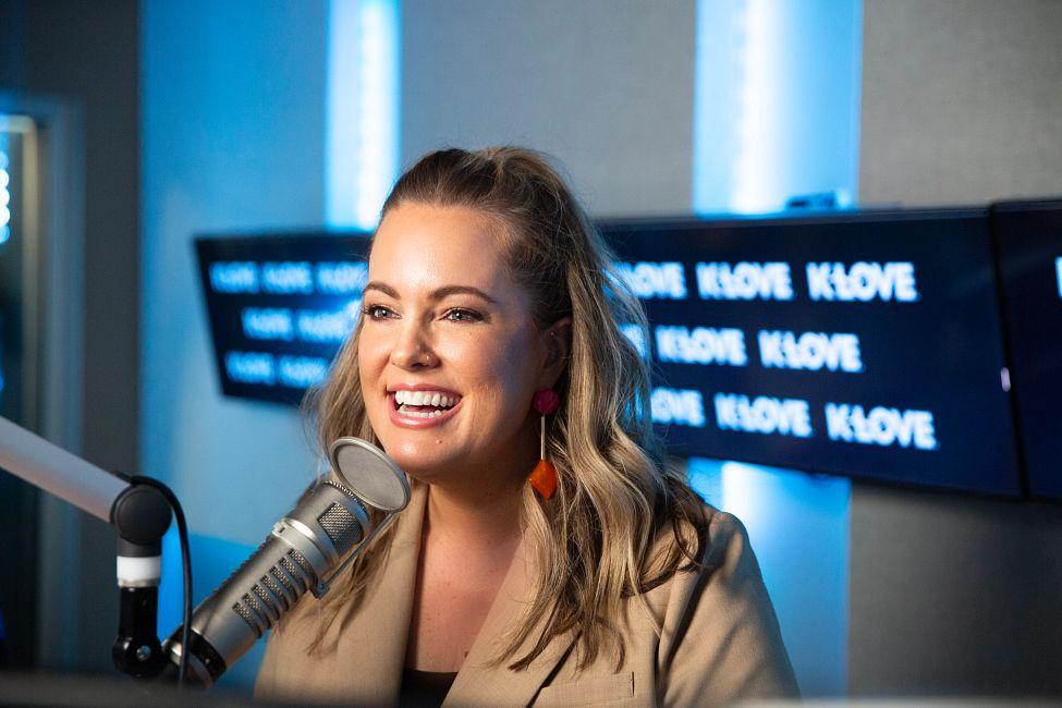 DJ Lauree talking in to a microphone