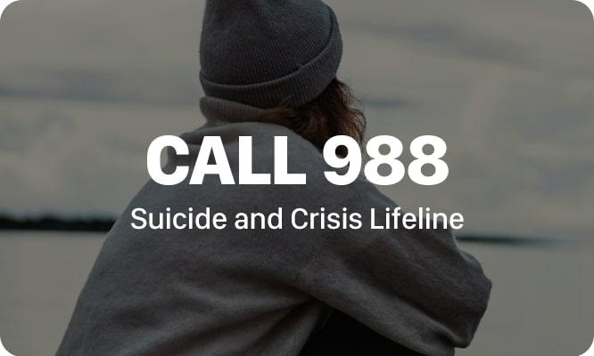 a person looking over water with the text 'call 988 suicide and crisis lifeline' at center